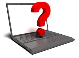 Red question symbol with black laptop on white background